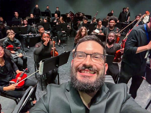 Paul Haarala with middle school strings students